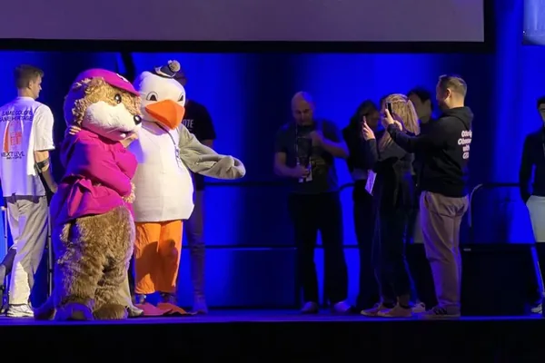 The BrightonSEO mascots on stage